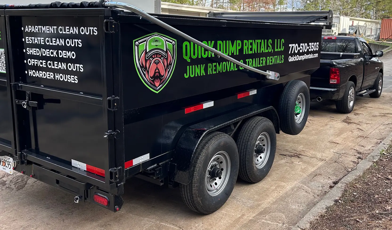 A dump truck with the company logo on it.