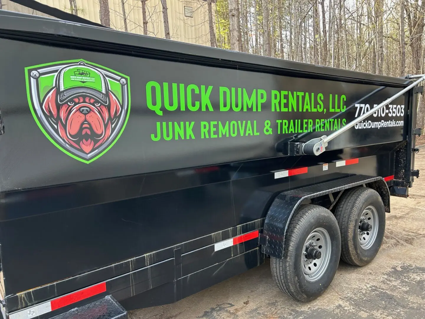 A dump truck with the words " quick dump rentals llc " on it.