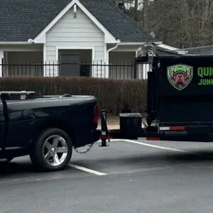 A truck and trailer are parked in the street.